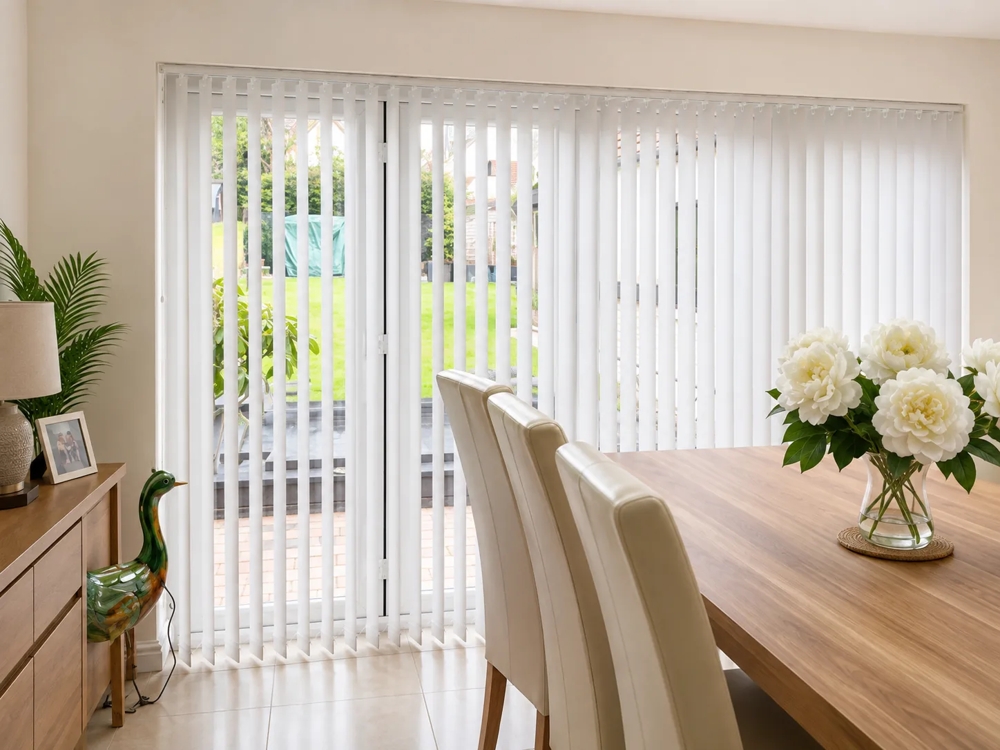 White Vertical Blinds fitted across wide patio doors.